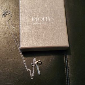 Peoples loop cross diamond necklace.